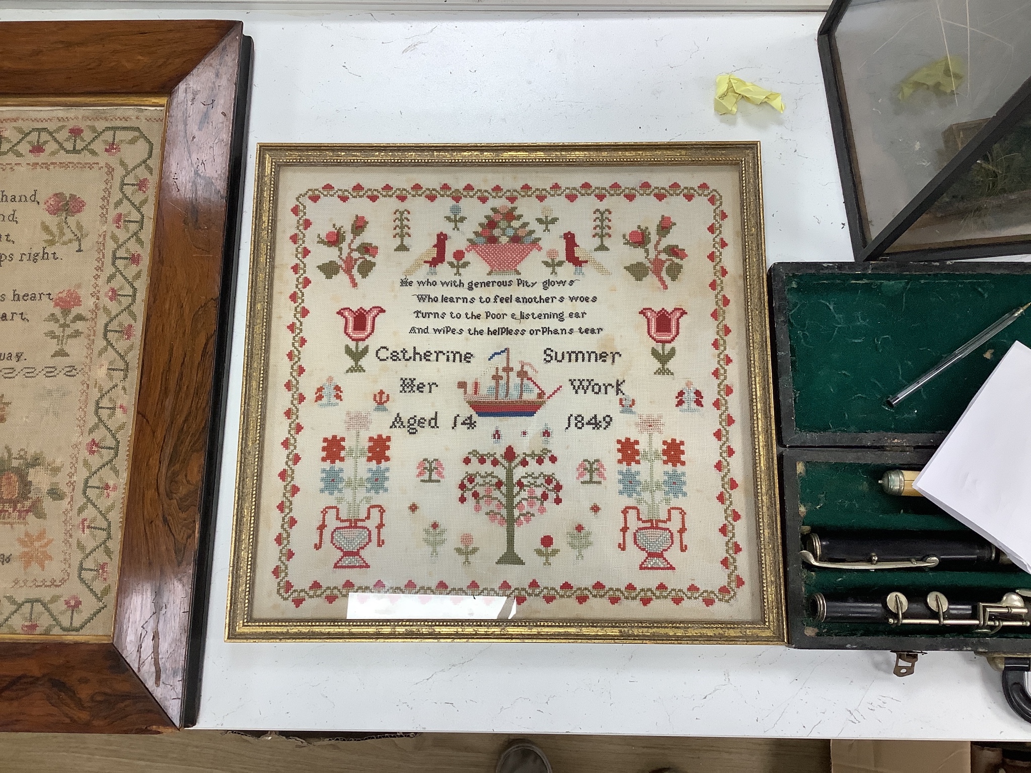 A William IV needlework sampler, worked with text and a lion, by Elizabeth Smith, dated 1836 and a Victorian needlework sampler, by Catherine Summer, dated 1849